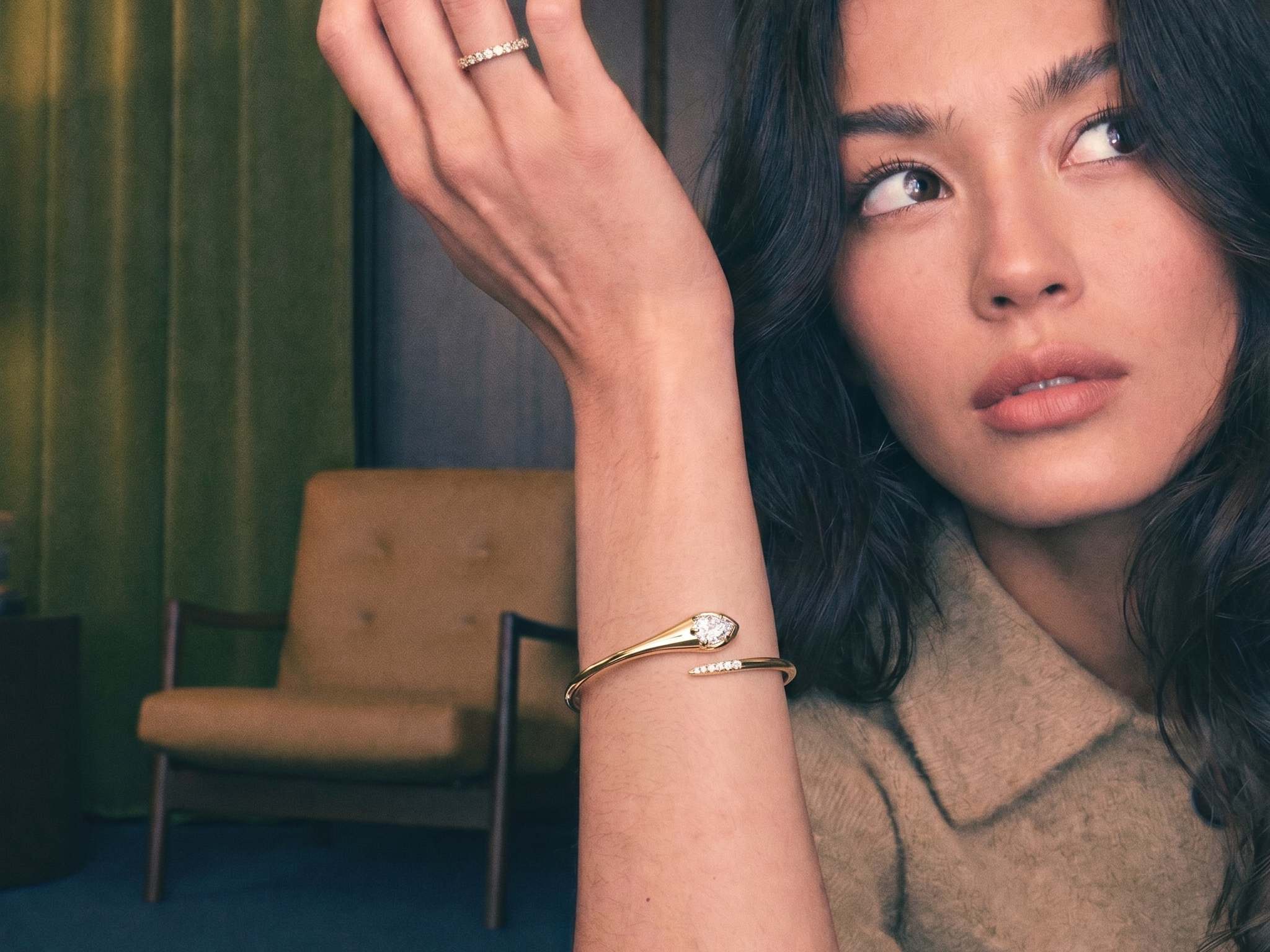 Pear-shaped lab grown diamond tennis bracelet on soft fabric in warm natural light