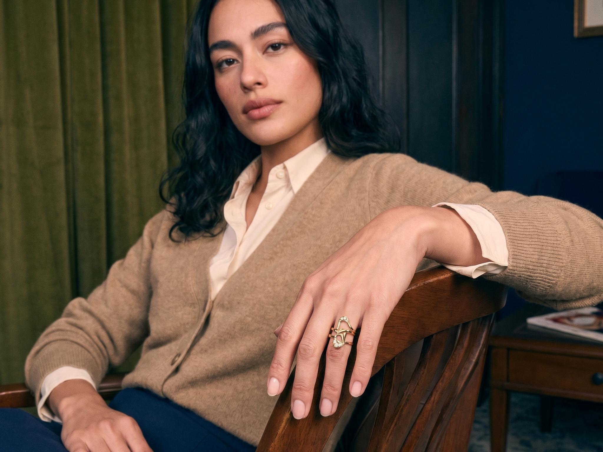 Hand wearing a handcrafted sculptural lab grown diamond gold ring, an example of custom jeweler craftsmanship