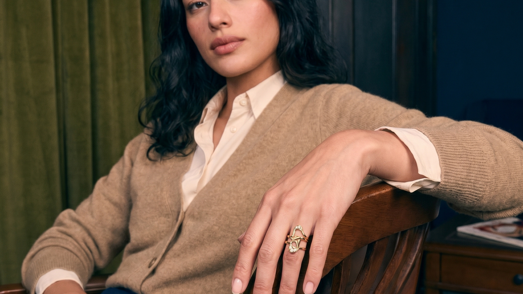 Handcrafted lost wax cast solid gold diamond ring worn on a hand in natural light