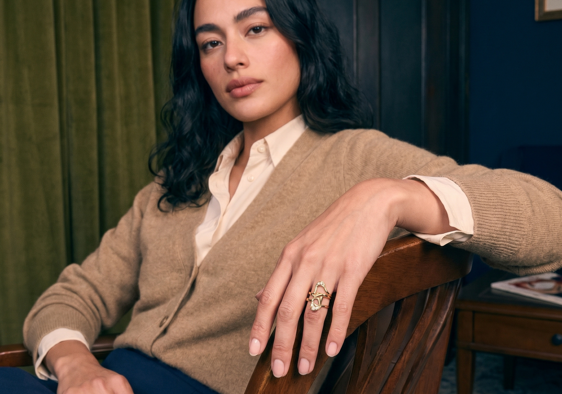 Handcrafted lost wax cast solid gold diamond ring worn on a hand in natural light