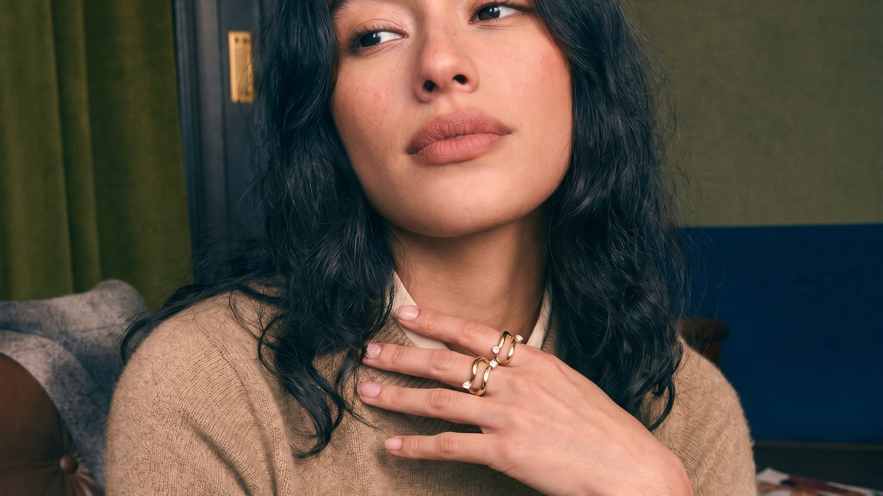 Two-stone toi et moi bypass ring in solid gold worn on a hand, two lab-grown diamonds set side by side