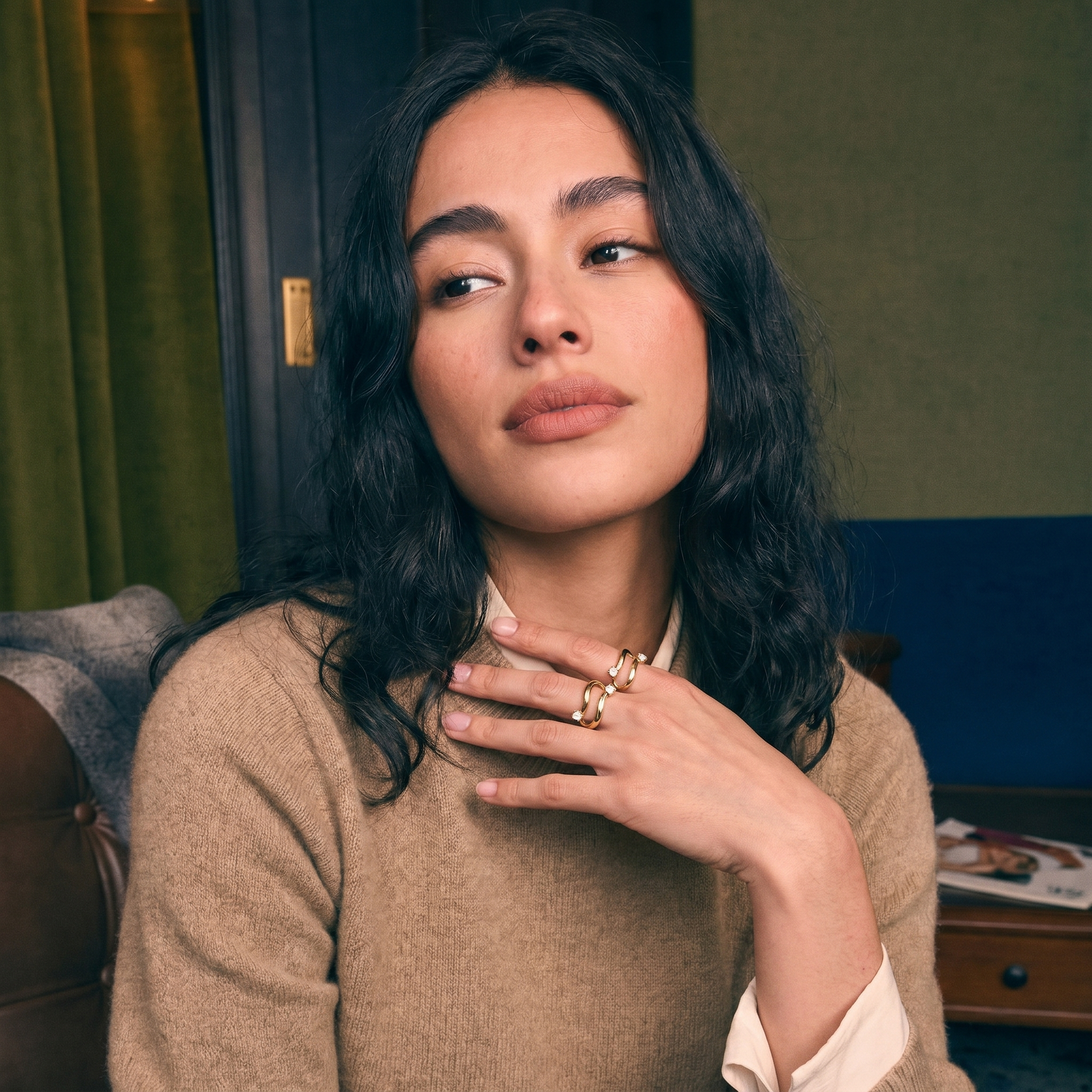 Two-stone toi et moi bypass ring in solid gold worn on a hand, two lab-grown diamonds set side by side