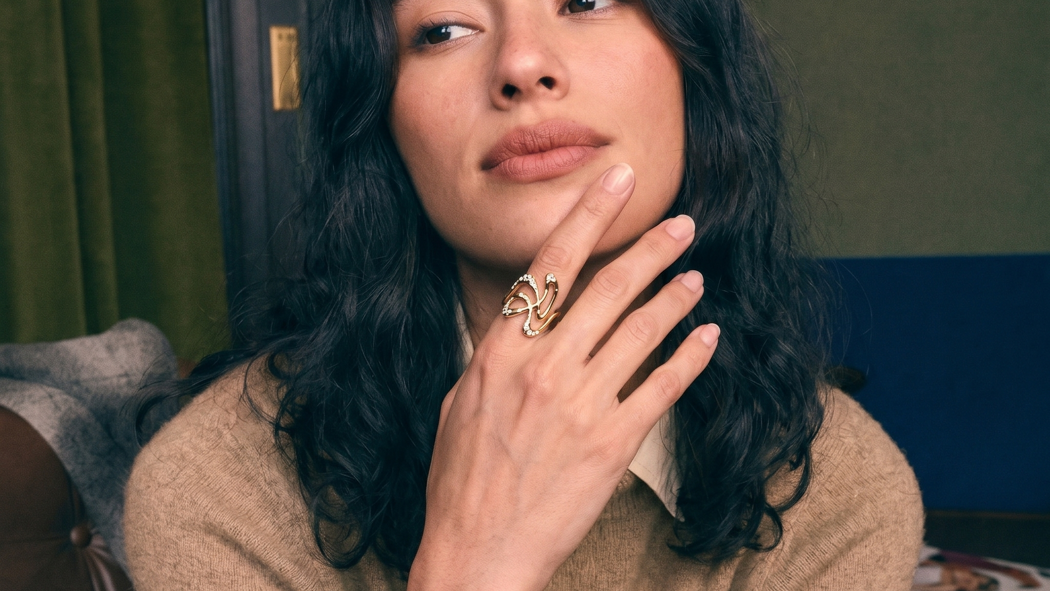 One-of-a-kind sculptural lab grown diamond engagement ring in solid gold, worn on the hand