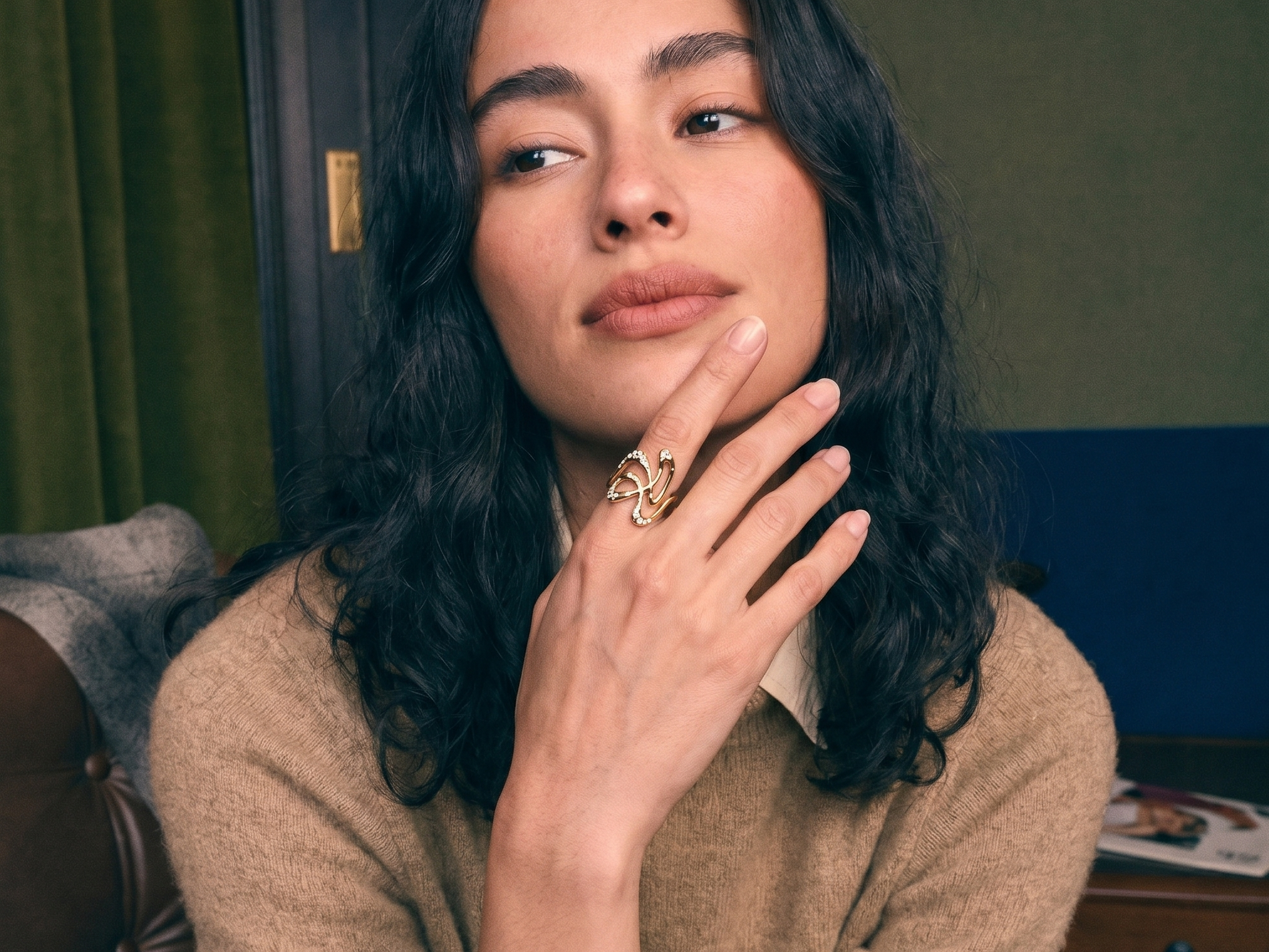 One-of-a-kind sculptural lab grown diamond engagement ring in solid gold, worn on the hand