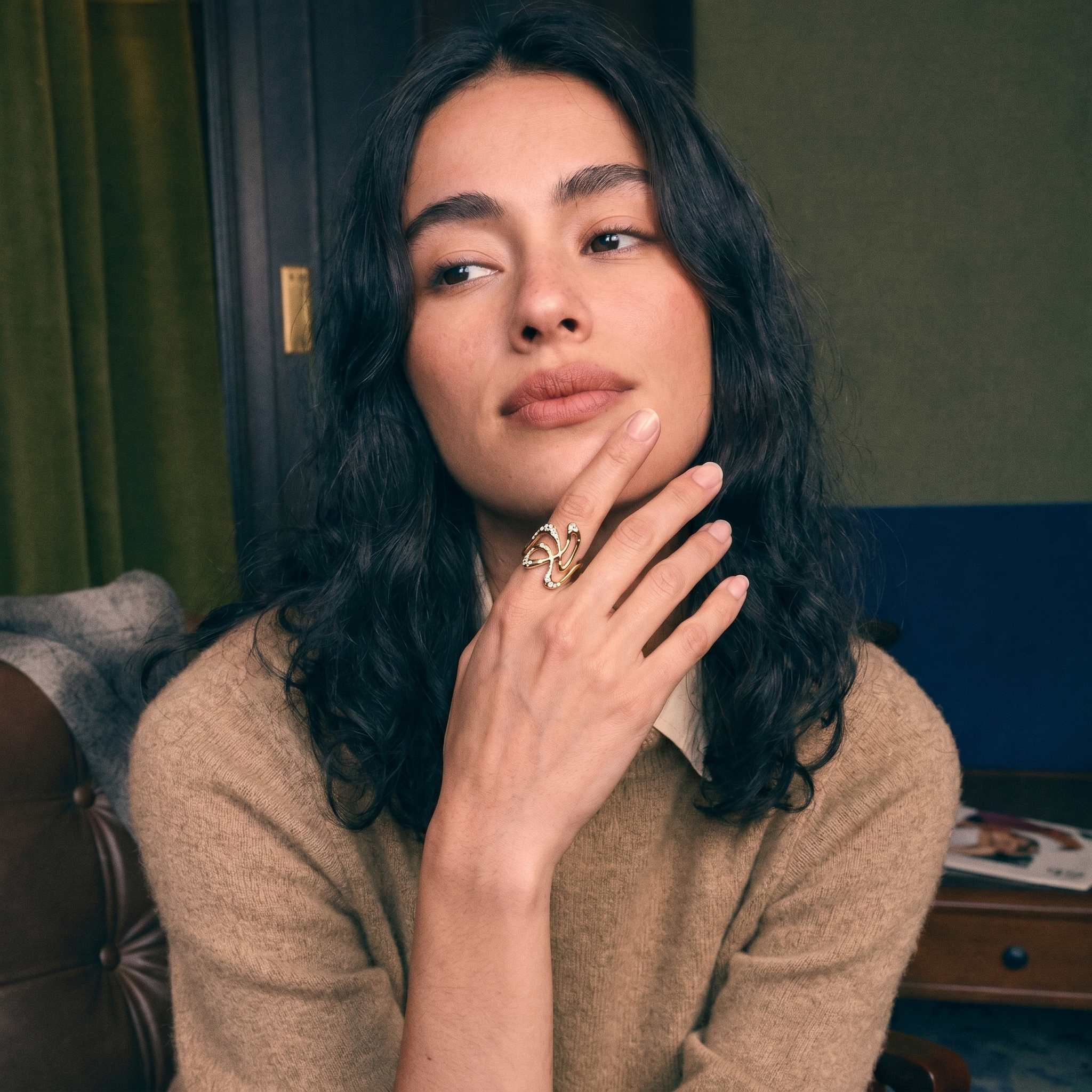 Heirloom diamond redesigned into a sculptural gold ring, worn on the hand