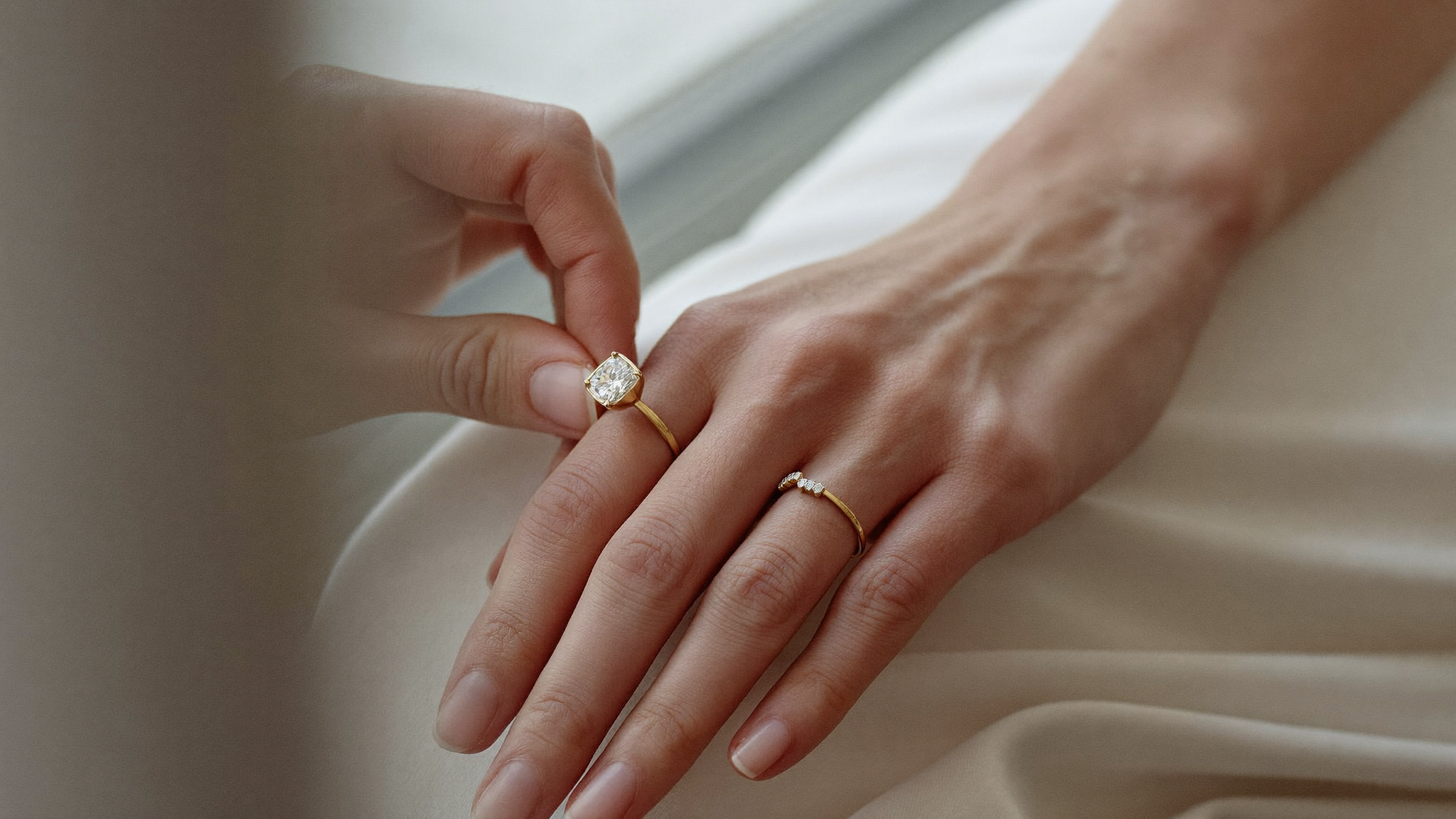 Slim solid gold lab-grown diamond band slipped onto a finger, a guide to measuring ring size at home